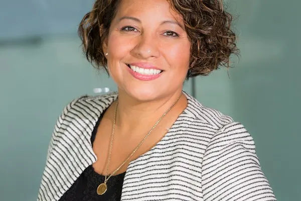 Smiling woman in a striped jacket
